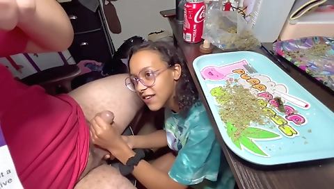 Ebony smoker getting her lips around a big black dick