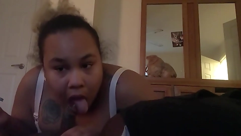 Big black girl enjoys her man's cock in a deepthroat scene