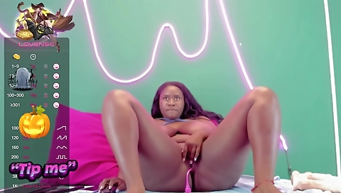 Ebony busty babe with massive tits takes out her webcam