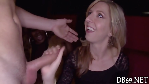 Ebony milf with large breasts and big cock is giving a blowjob