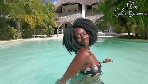 Brazilian model in a pool has big cock on her back