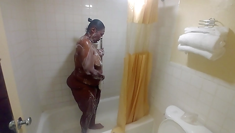 Ebony milf enjoying a shower after showers in bedroom