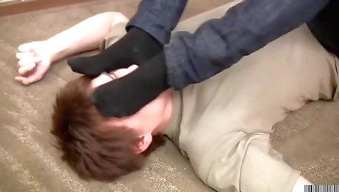 Black girl is doing a foot job for her boyfriend in the video