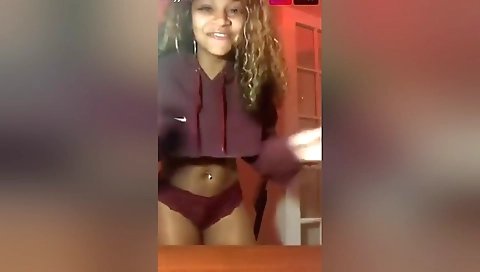 Ebony babe spreads her ass cheeks in a solo video clip