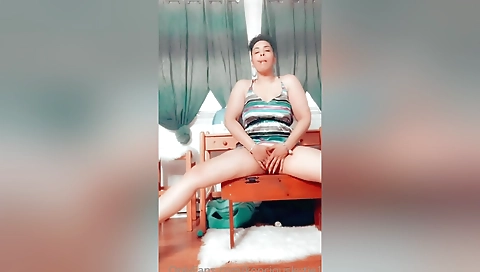 Ebony brunette flashes her pussy in front of the webcam