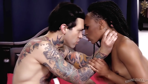 Amateur interracial threesome with a tattooed ebony