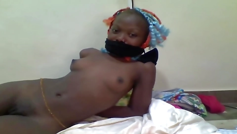 Pussy is covered with a bondage ring as a girl takes it