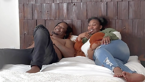 Petite ebony chick plays with a big cock in front of the webcam