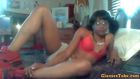 Ebony beauty in a sexy outfit is showing her body in front